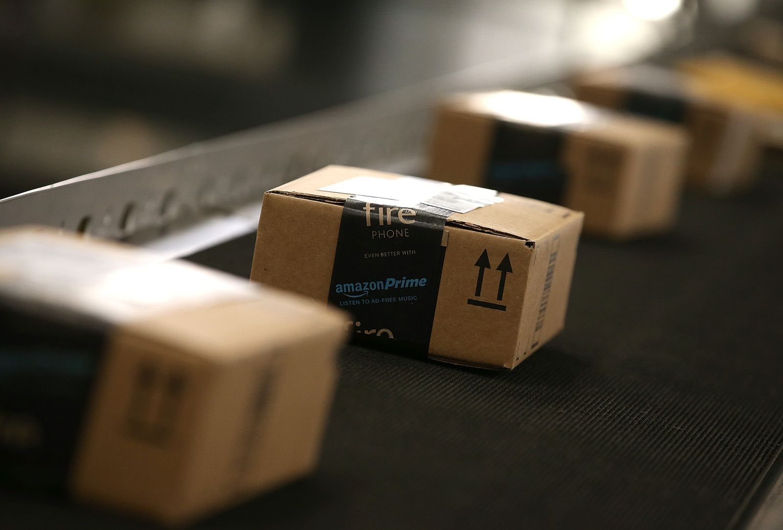 Boxes move along a conveyor belt at an Amazon fulfillment center