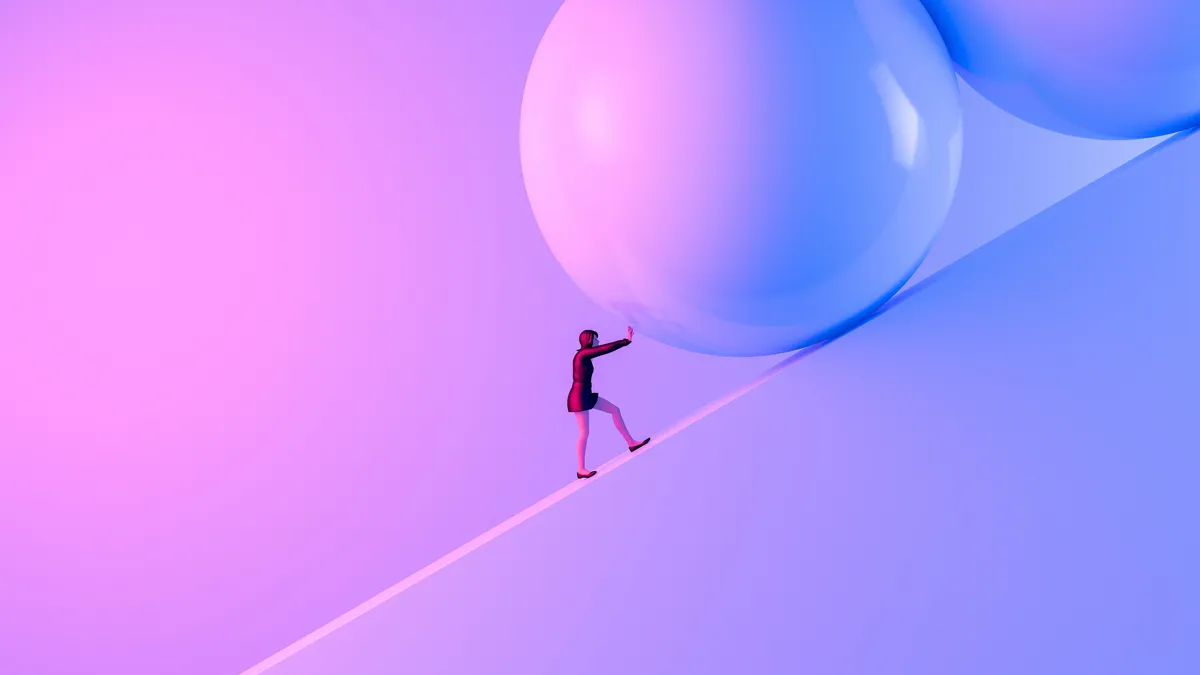 Business Woman pushing large stone uphill